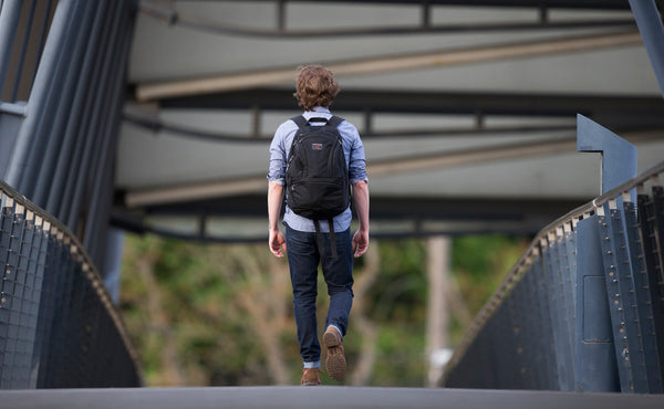 A person walking on a sidwalk with the Synapse 25.